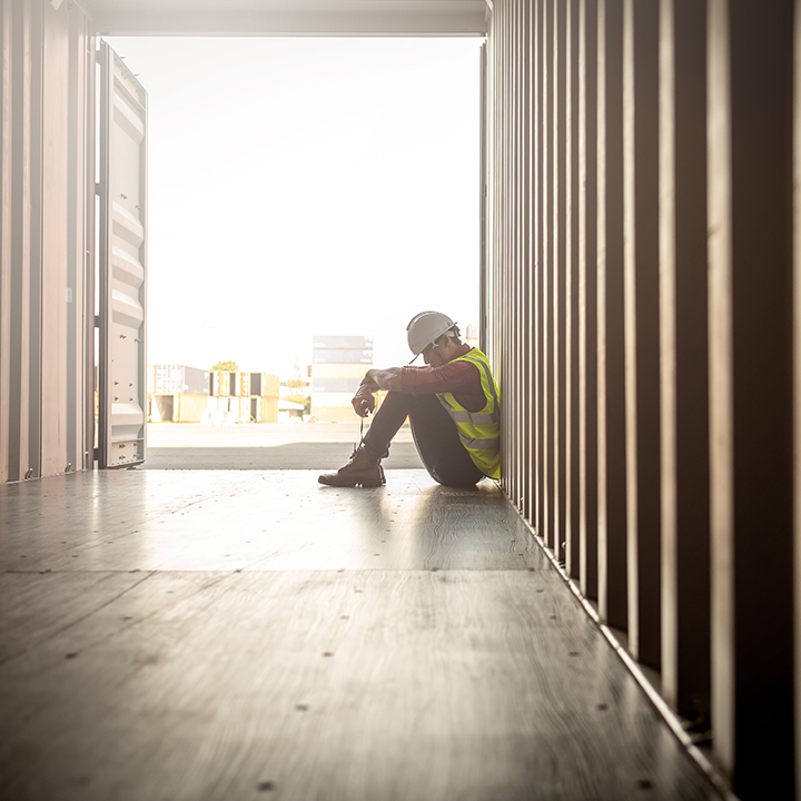 despair staff in logistic business sittng in container